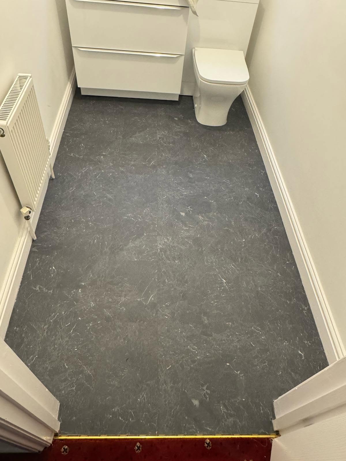 Grey vinyl fitted in a cloakroom