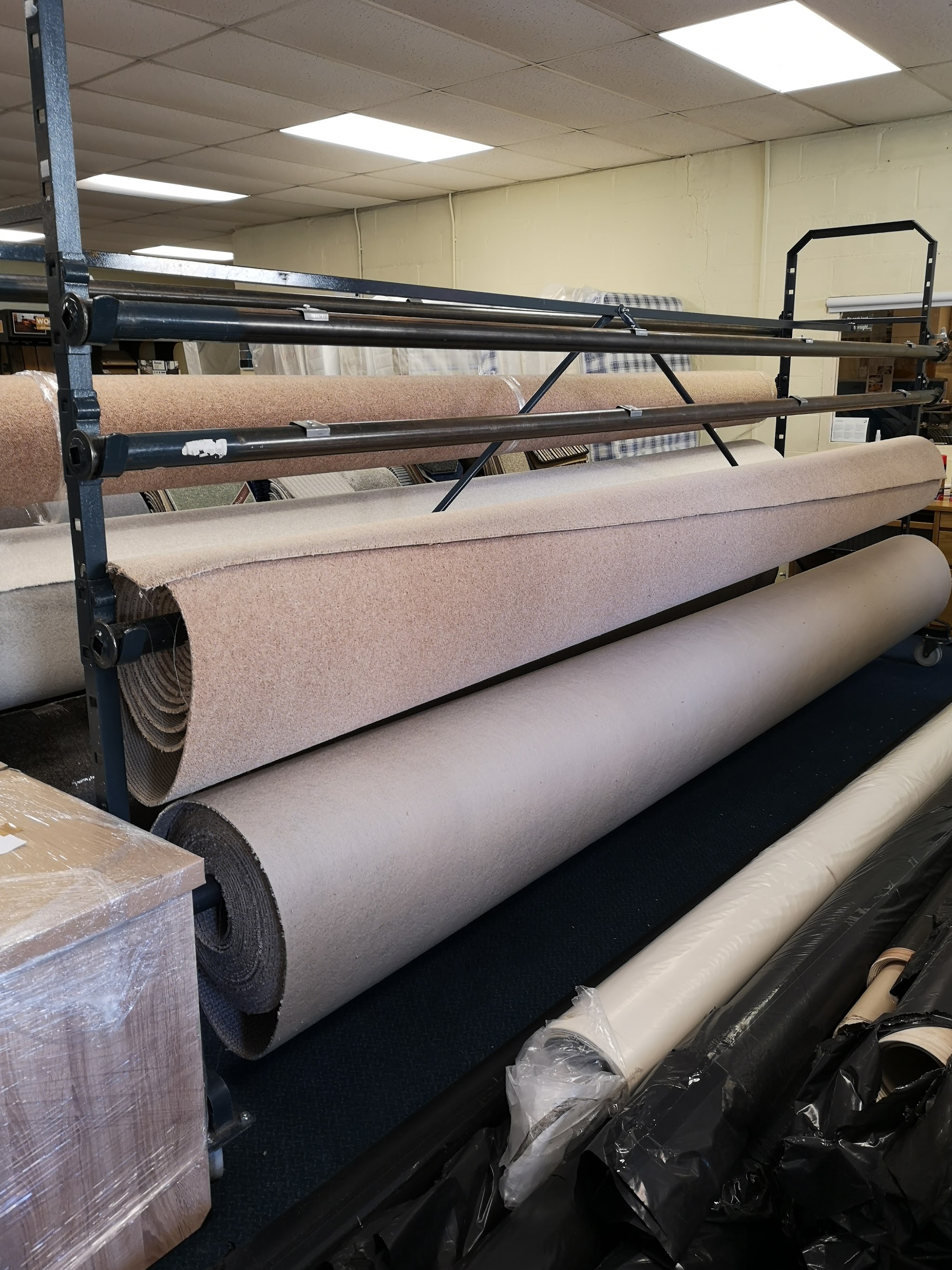 Carpet rolls on racks ready to cut